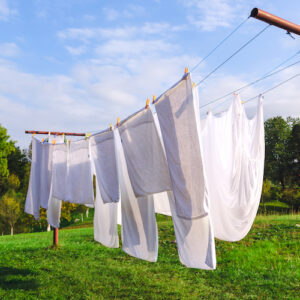 White linen hanging on the clothesline and dried