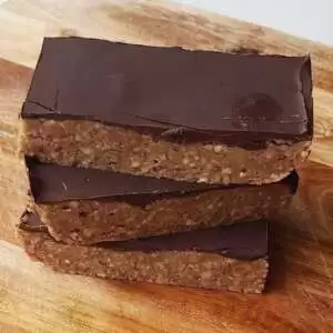 Paleo Protein Bars in a tack on wooden board