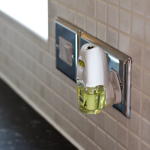 Plug in air freshener in a wall socket in the kitchen