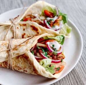 jackfruit souvlaki tied with string on a plate