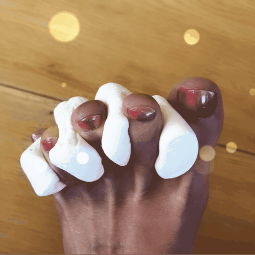 painted toes with marshmallows as toe separators