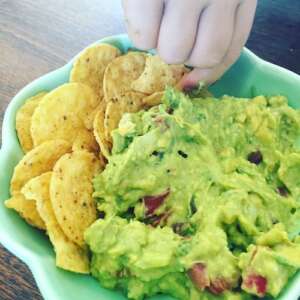 Probiotic Guacamole in a bowl with corn chips