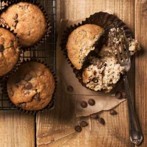 Banana chocolate chip muffins on cooking rack