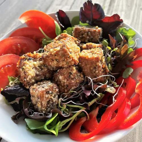 hemp heart crusted tofu on salad