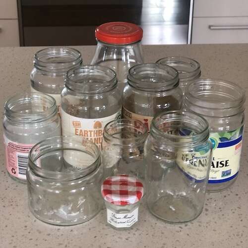 many jars on a bench ready to be sterilised