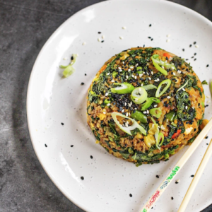 vegan 'egg' fried rice on plate with chopsticks