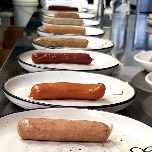 vegan sausages on plates